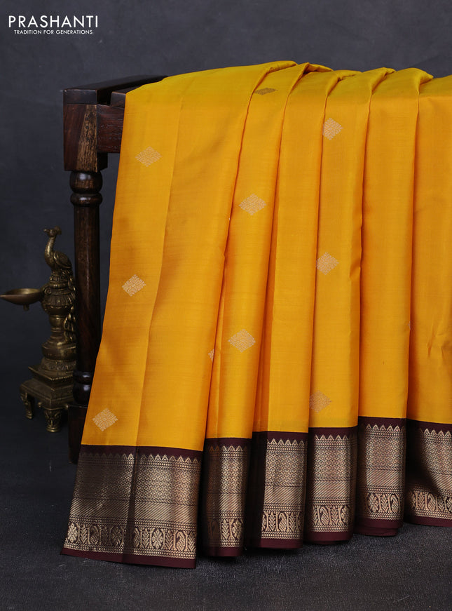 Pure kanchipuram silk saree yellow and coffee brown with zari woven buttas and zari woven korvai border