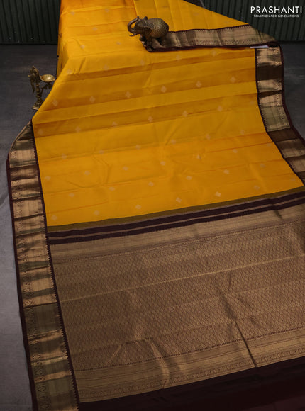 Pure kanchipuram silk saree yellow and coffee brown with zari woven buttas and zari woven korvai border
