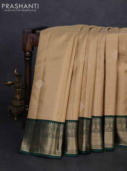 Pure kanchipuram silk saree sandal and dark green with zari woven buttas and zari woven korvai border