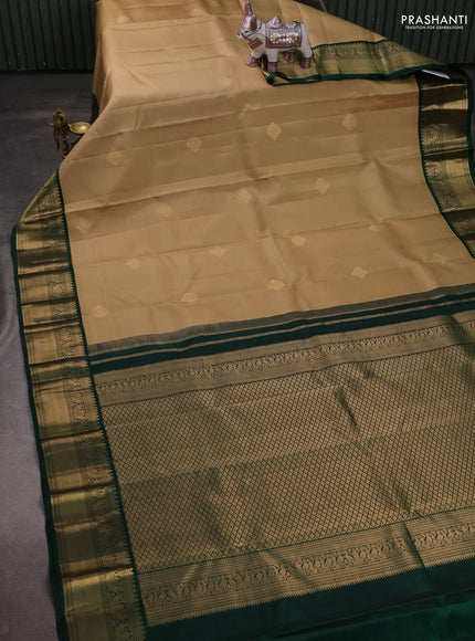 Pure kanchipuram silk saree sandal and dark green with zari woven buttas and zari woven korvai border