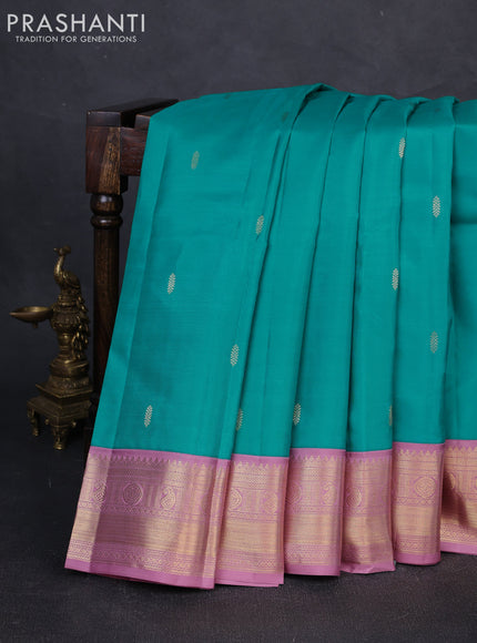 Pure kanchipuram silk saree teal blue and pastel pink with zari woven buttas and zari woven korvai border