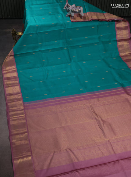 Pure kanchipuram silk saree teal blue and pastel pink with zari woven buttas and zari woven korvai border