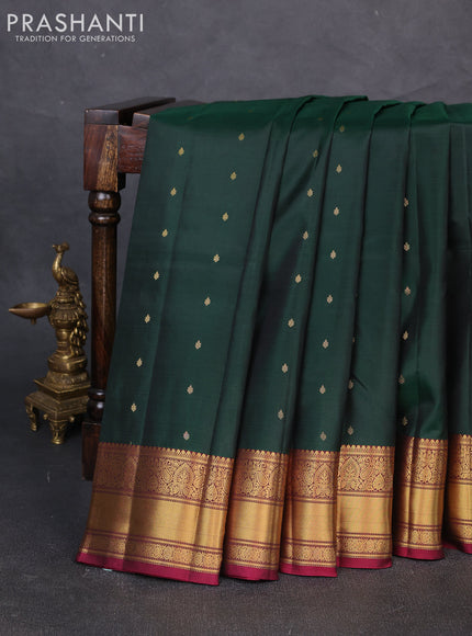 Pure kanchipuram silk saree bottle green and dark magenta pink with allover zari woven buttas and zari woven border