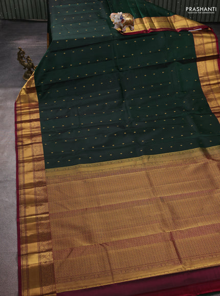 Pure kanchipuram silk saree bottle green and dark magenta pink with allover zari woven buttas and zari woven border