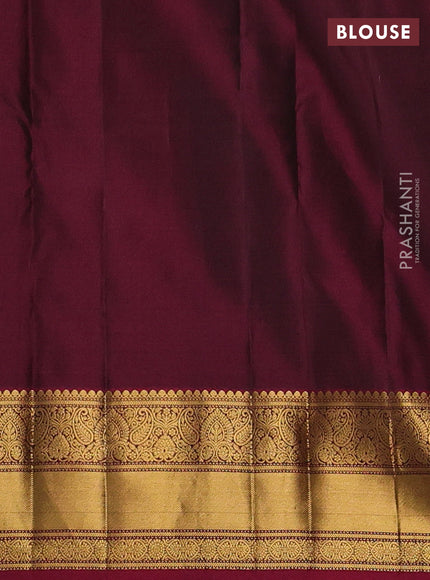 Pure kanchipuram silk saree bottle green and dark magenta pink with allover zari woven buttas and zari woven border