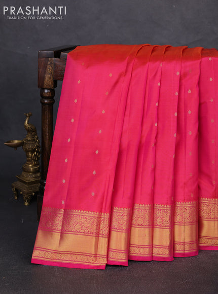 Pure kanchipuram silk saree dual shade of pinkish orange with allover zari woven buttas and zari woven border