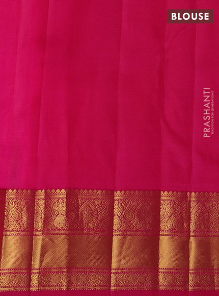 Pure kanchipuram silk saree dual shade of pinkish orange with allover zari woven buttas and zari woven border