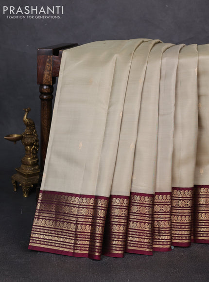 Pure kanchipuram silk saree beige and wine shade with zari woven buttas and zari woven korvai border