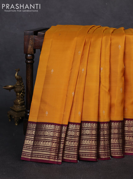 Pure kanchipuram silk saree mustard yellow and wine shade with zari woven buttas and zari woven korvai border