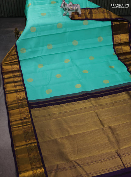 Pure kanchipuram silk saree teal green shade and violet with zari woven buttas and rich zari woven korvai border