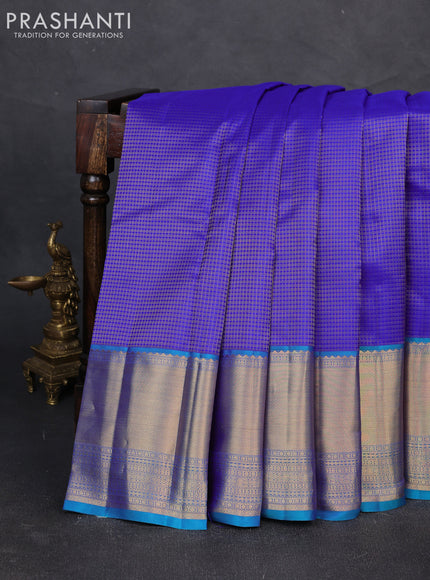 Pure kanchipuram silk saree blue and dual shade of teal green with allover zari woven small checked pattern and long zari woven border