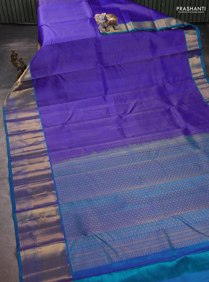 Pure kanchipuram silk saree blue and dual shade of teal green with allover zari woven small checked pattern and long zari woven border