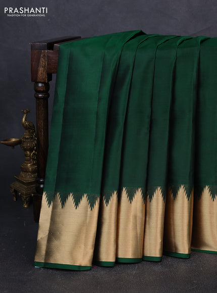 Pure kanchipuram silk saree dark green with plain body and temple design zari woven border