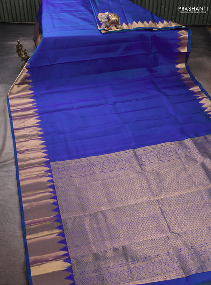 Pure kanchipuram silk saree blue with plain body and temple design zari woven border