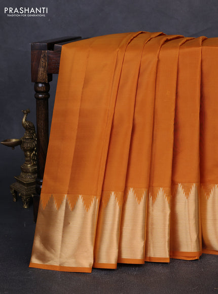 Pure kanchipuram silk saree mustard yellow with plain body and temple design zari woven border