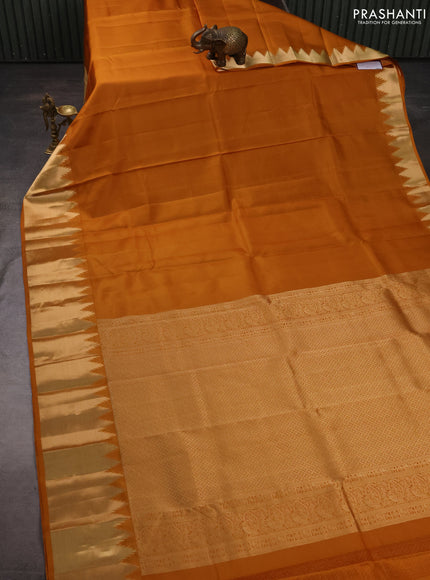 Pure kanchipuram silk saree mustard yellow with plain body and temple design zari woven border
