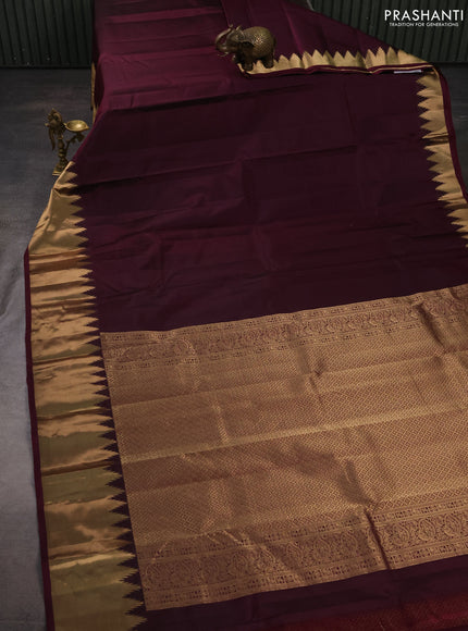 Pure kanchipuram silk saree wine shade with plain body and temple design zari woven border