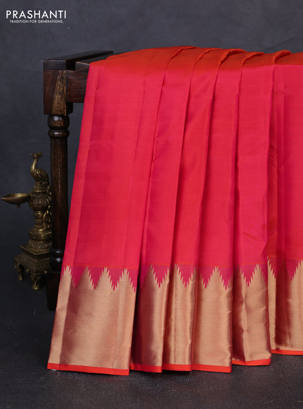 Pure kanchipuram silk saree pinkish orange with plain body and temple design zari woven border