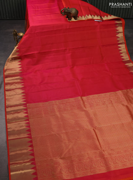 Pure kanchipuram silk saree pinkish orange with plain body and temple design zari woven border