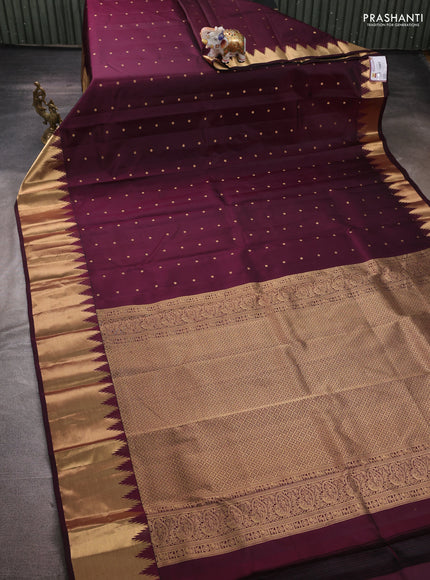 Pure kanchipuram silk saree deep wine shade with zari woven buttas and temple design zari woven border