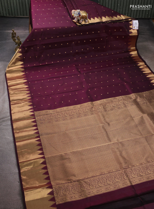 Pure kanchipuram silk saree deep wine shade with zari woven buttas and temple design zari woven border