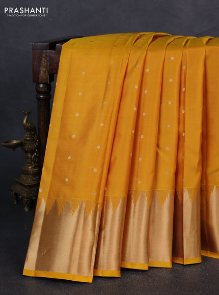 Pure kanchipuram silk saree mustard yellow with zari woven buttas and temple design zari woven border