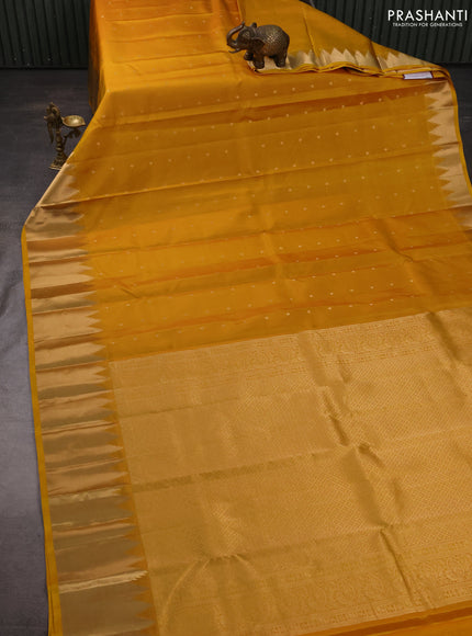 Pure kanchipuram silk saree mustard yellow with zari woven buttas and temple design zari woven border