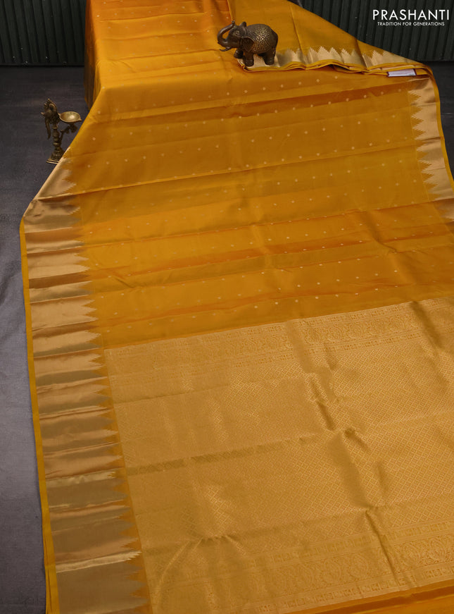 Pure kanchipuram silk saree mustard yellow with zari woven buttas and temple design zari woven border