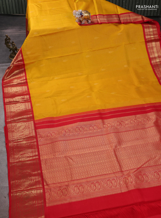 Pure kanchipuram silk saree mustard yellow and red with allover zari strips & buttas and rich zari woven korvai border