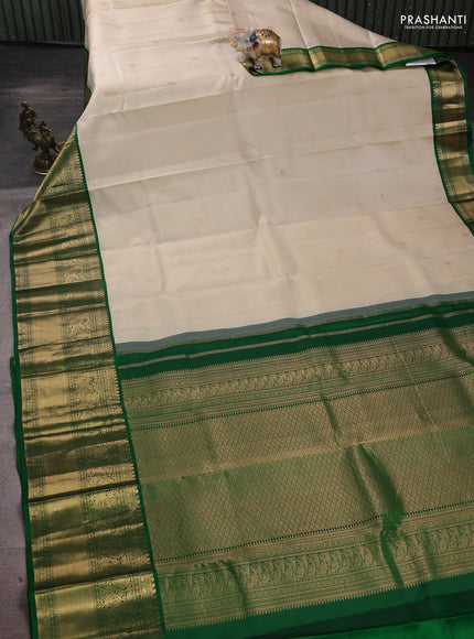 Pure kanchipuram silk saree cream and green with zari woven buttas and long rich zari woven korvai border