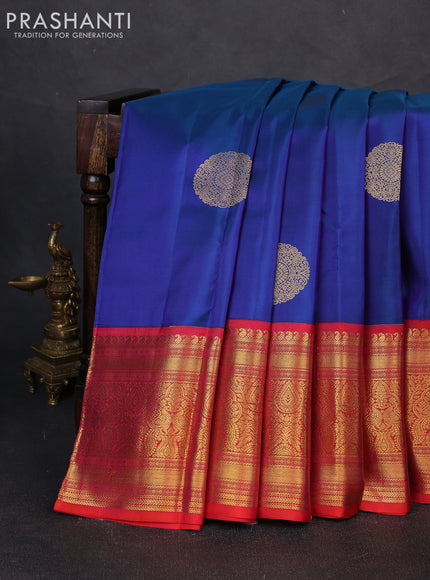 Pure kanchipuram silk saree dual shade of bluish green and dual shade of orange with zari woven buttas and long rich zari woven korvai border