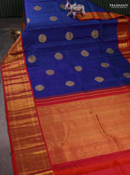 Pure kanchipuram silk saree dual shade of bluish green and dual shade of orange with zari woven buttas and long rich zari woven korvai border