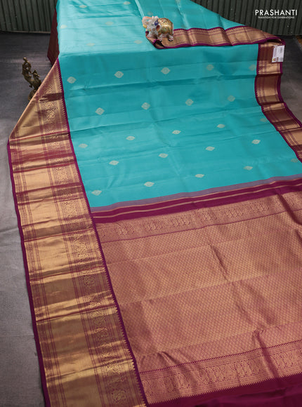 Pure kanchipuram silk saree teal blue and purple with zari woven buttas and long rich zari woven korvai border