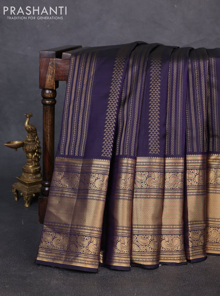 Pure kanchipuram silk saree dark blue and mild peach pink with allover zari weaves and long rich zari woven border
