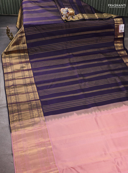 Pure kanchipuram silk saree dark blue and mild peach pink with allover zari weaves and long rich zari woven border