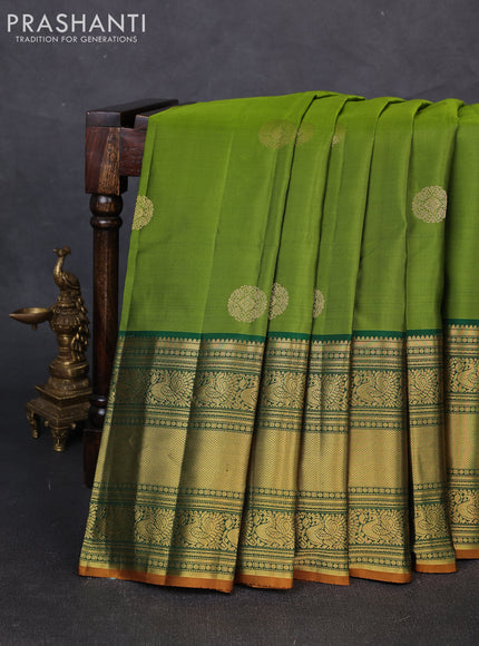 Pure kanchipuram silk saree mehendi green and green with zari woven buttas and long rich zari woven korvai border