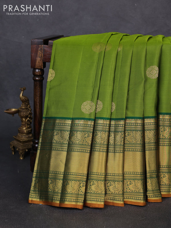 Pure kanchipuram silk saree mehendi green and green with zari woven buttas and long rich zari woven korvai border