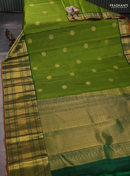 Pure kanchipuram silk saree mehendi green and green with zari woven buttas and long rich zari woven korvai border