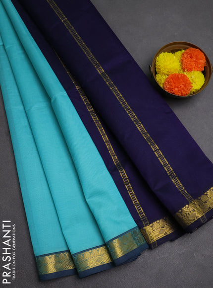 Silk cotton saree mild teal blue and navy blue with plain body and zari woven border
