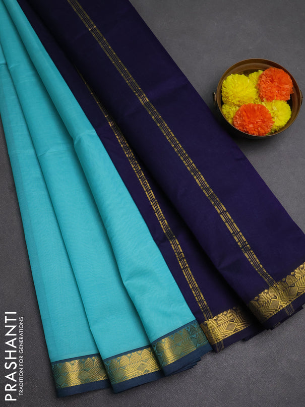 Silk cotton saree mild teal blue and navy blue with plain body and zari woven border