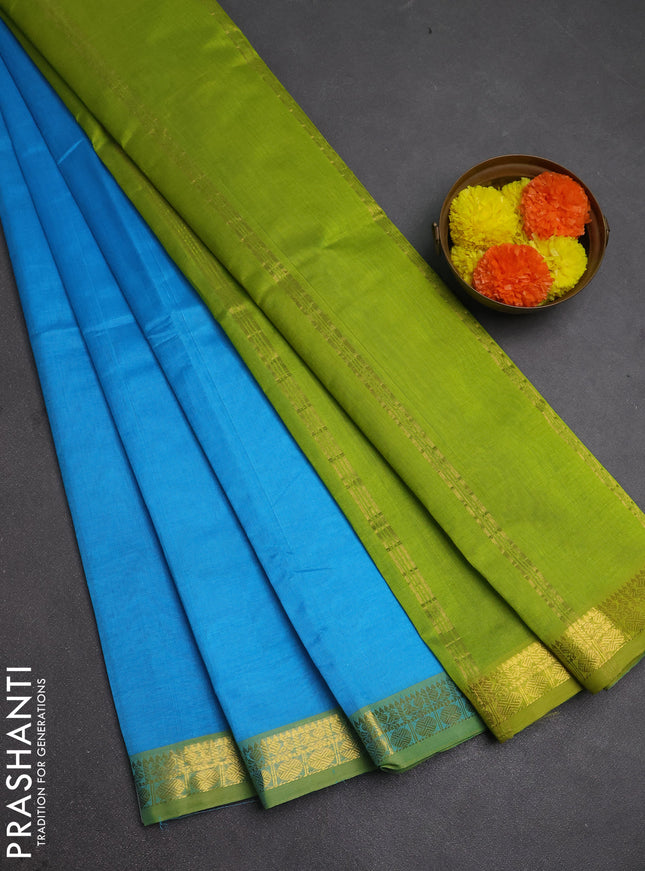Silk cotton saree light blue and light green with plain body and zari woven border