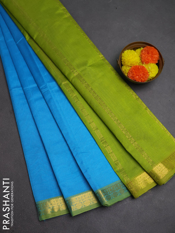 Silk cotton saree light blue and light green with plain body and zari woven border