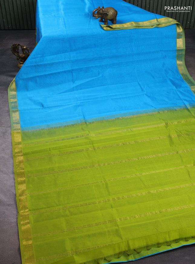 Silk cotton saree light blue and light green with plain body and zari woven border