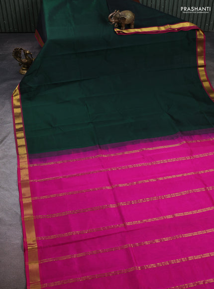 Silk cotton saree bottle green and pink with plain body and zari woven border