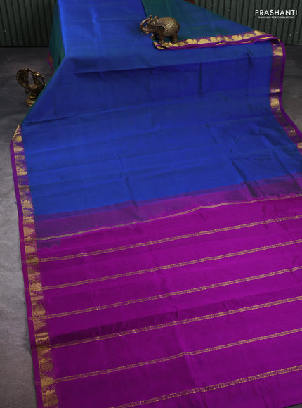 Silk cotton saree dual shade of bluish green and purple with plain body and zari woven border