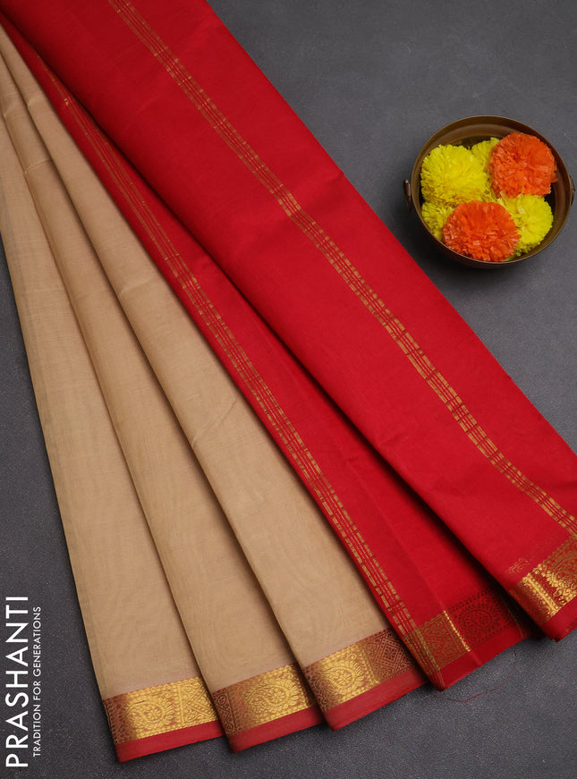 Silk cotton saree beige and red with plain body and zari woven border