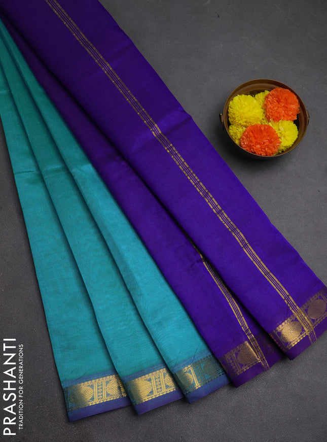 Silk cotton saree light blue and violet with plain body and zari woven border