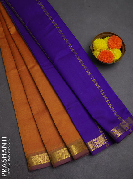 Silk cotton saree dark mustard and violet with plain body and zari woven border