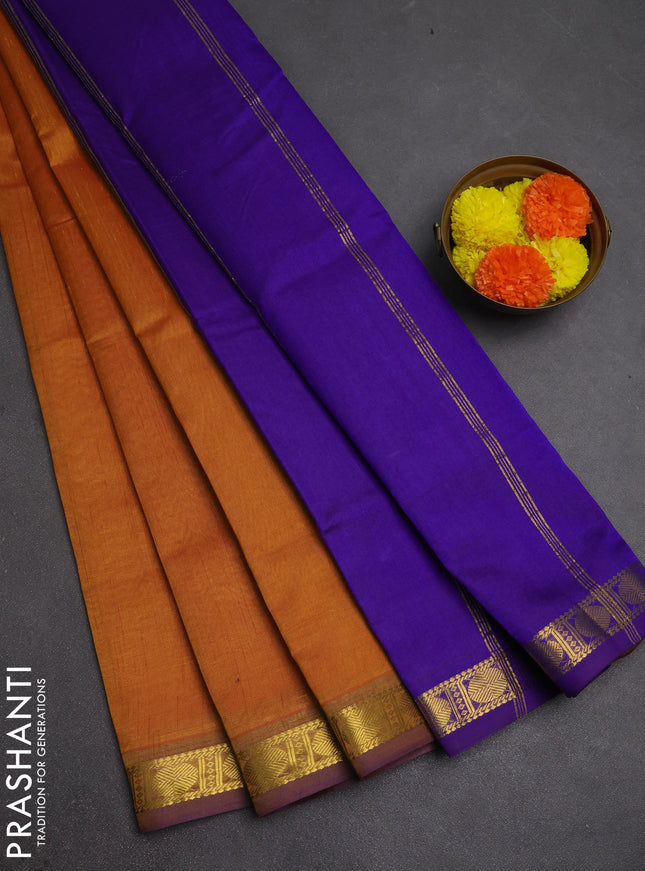 Silk cotton saree dark mustard and violet with plain body and zari woven border