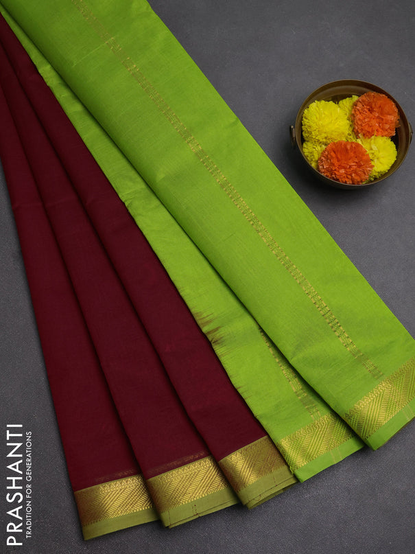 Silk cotton saree maroon and light green with plain body and zari woven border